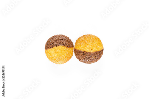 Group of two whole fresh baked marble muffin flatlay isolated on white background photo