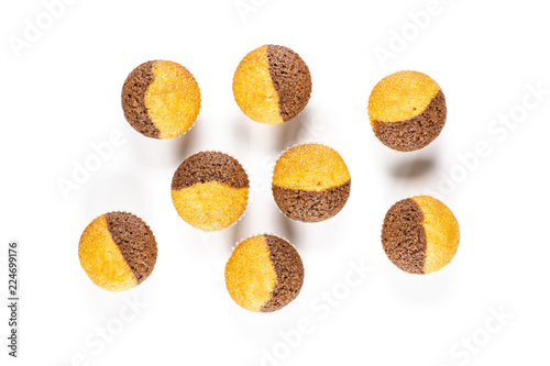 Group of eight whole fresh baked marble muffin flatlay isolated on white background photo