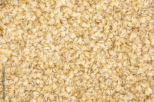 Lot of whole flat raw rolled oats flatlay isolated