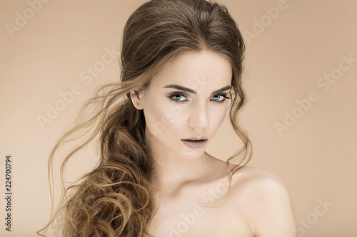 Studio portrait. Cosmetology, cosmetics and make-up. beautiful young woman with long brunette hair.