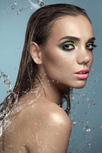 portrait of a woman in water. Studio portrait of a beautiful young woman.Cosmetology, cosmetics and make-up.