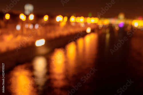 Bokeh river in the city at night as a background