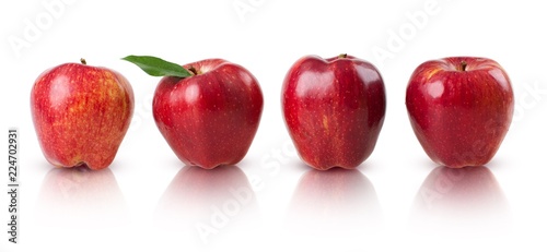 Line of apples with one apple having a leaf