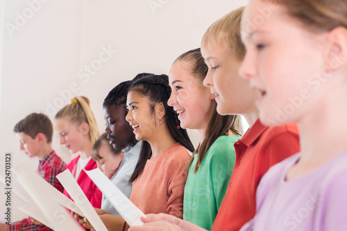 Group Of School Children Singing In Choir Together photo