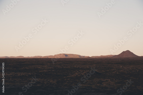 Large field with mountain in the distance in Iceland