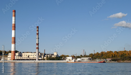 Industrial zone on the river. Chimney