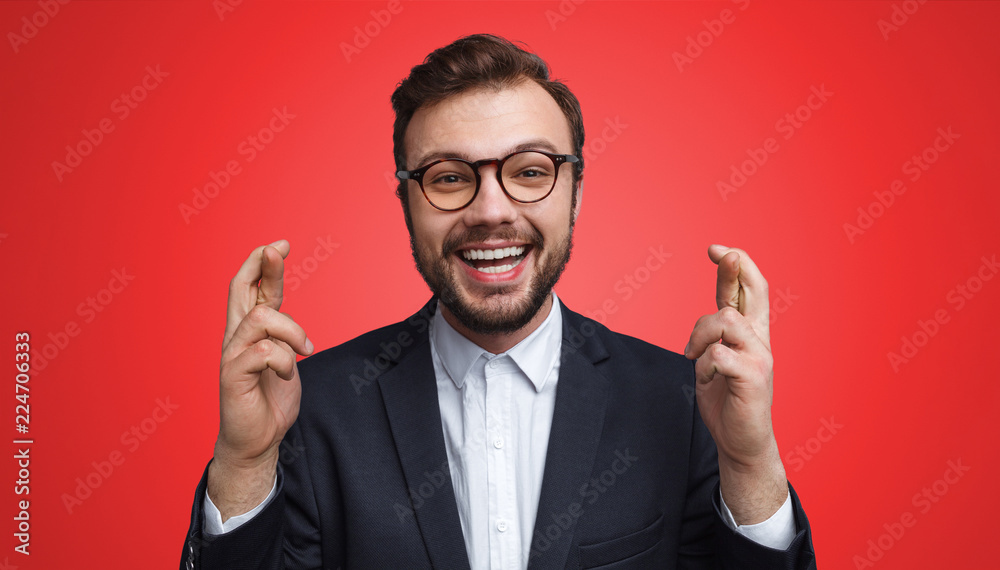 Cheerful businessman making wish Cheerful businessman making wish