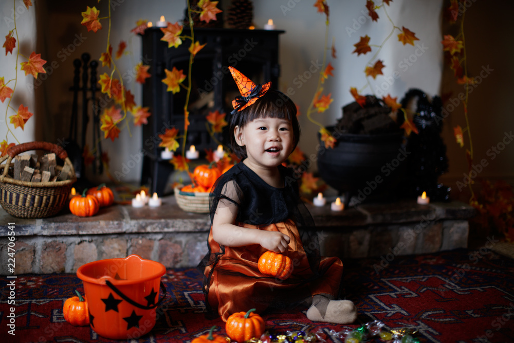 Toddler girl playing in Halloween party