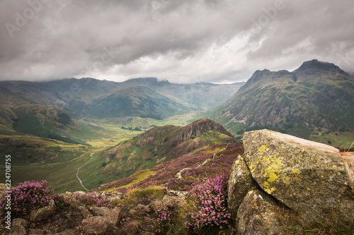 Crazy view into great and little langdale with heather hillside and cloudy sky Lake district England photo