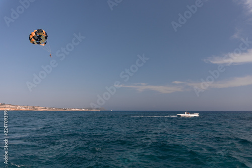 parasailing. the man is flying with a yellow parachute. close-up.