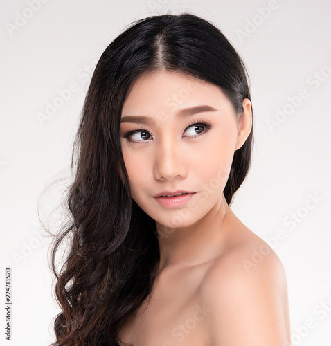 Young asian woman with clean skin of the face. © kitthanes