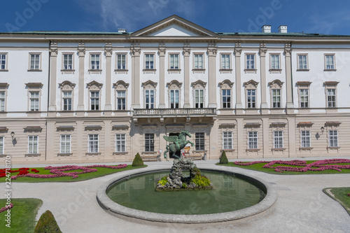 Facade of Schloss Mirabell Palace, with a bronze Pegasus on Pegasus Fountain in front, sculptor Kaspar Gras, Salzburg Austria.