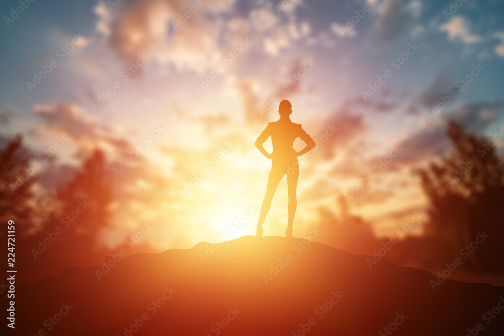 Creative background, business silhouette, business girl on the background of a beautiful, golden sunset. The concept of inspiration, enthusiasm, start-up, feminism symphony.