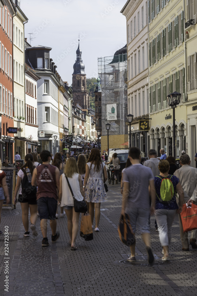 European lifestyle, the main street in the popular european travel destination Heidelberg,  a lot of people, and shops. Germany, Europe. 