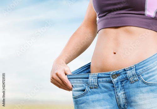 Young fit woman, weight loss concept © BillionPhotos.com