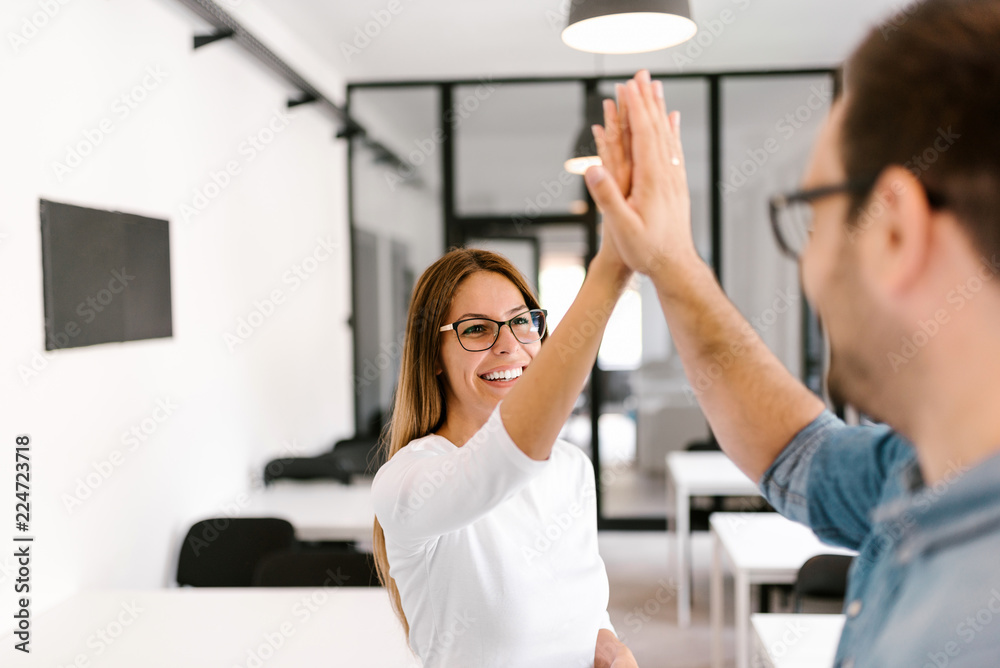 High-five! Teamwork success concept.