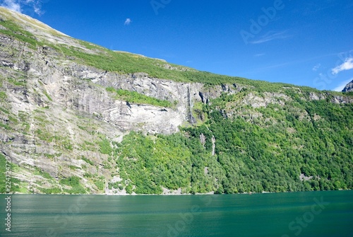 View of nearby mountains and waterfalls from the Geirangerfjord in Norway
