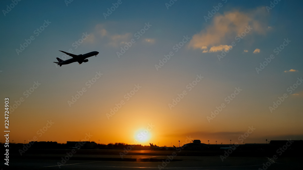 Plane taking off sky sunset sun dusk in airport China. Beijing.