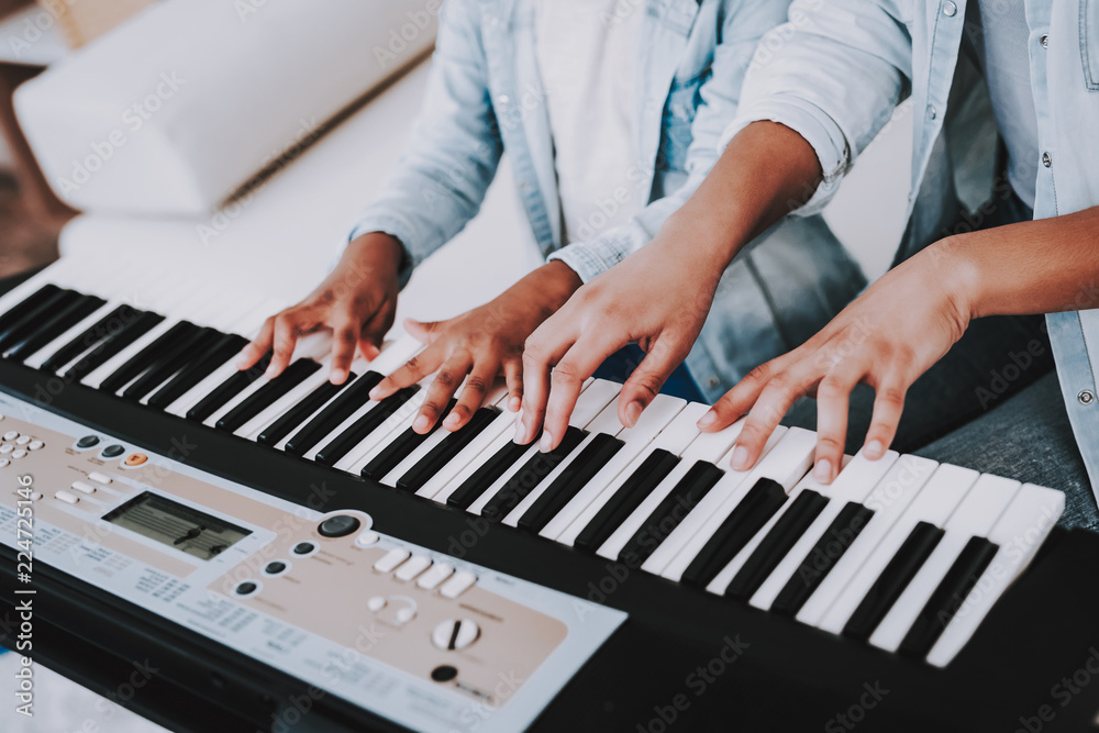 Obraz premium Piano and Young Girl Play Together. Happy Time.