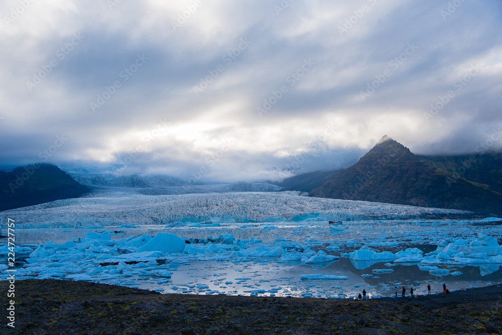Iceland's Fjallsarlon Glacial Lagoon, evening landscape with storm clouds