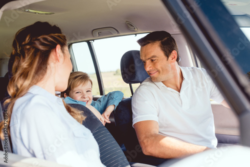 beautiful family riding car together and having fun © LIGHTFIELD STUDIOS