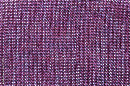 Dark violet textile background with checkered pattern, closeup. Structure of the fabric macro.
