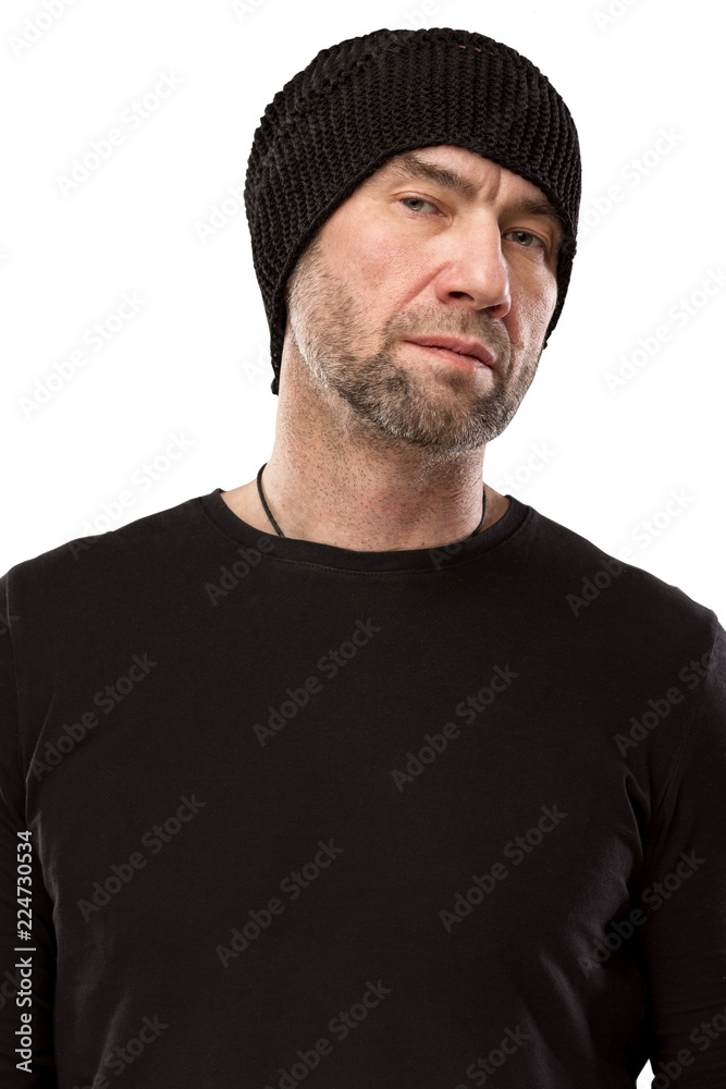 Serious brutal man in hat, isolated on white background Serious brutal man in hat, isolated on white background