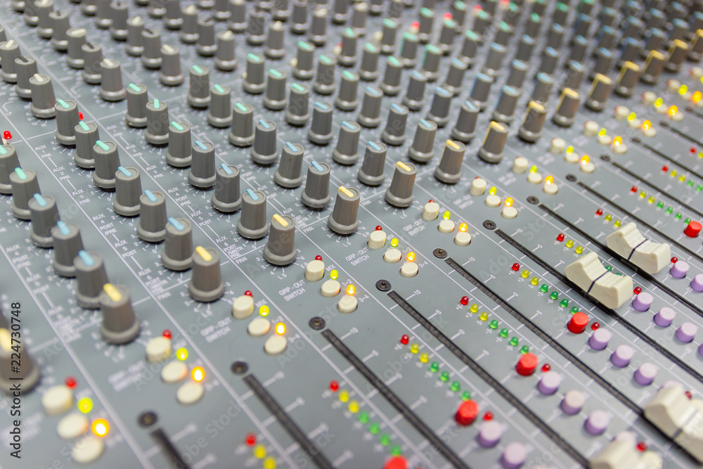 Fototapeta premium Close up Mixing Console of a big HiFi system, The audio equipment and control panel of digital studio mixer