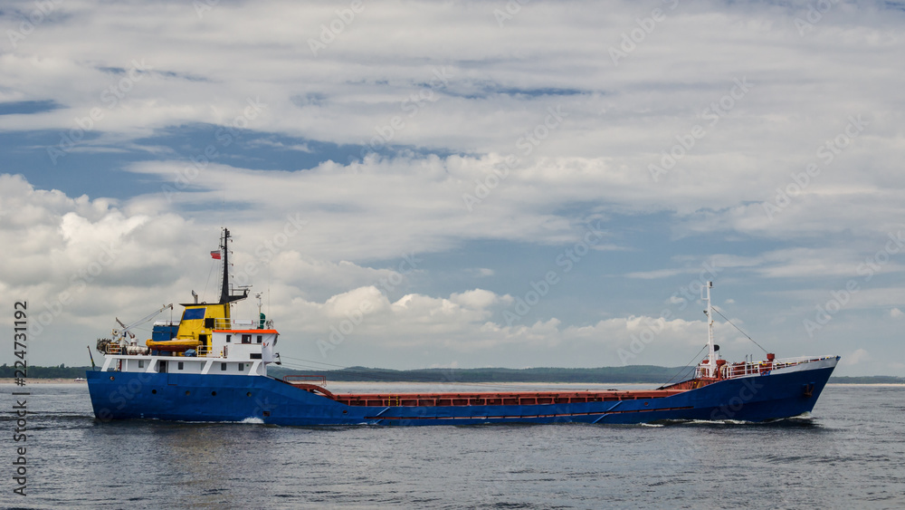 GENERAL CARGO SHIP - Freighter is sailing on the sea
