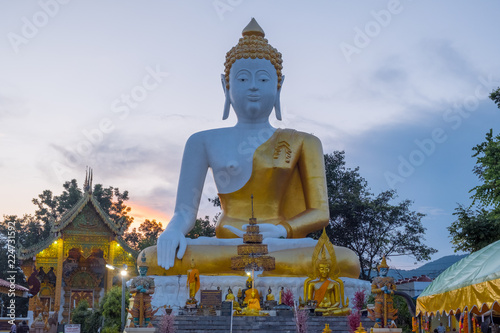 Pagoda stupa at Wat-Pratatdoikham (temple name), Chiangmai, Thailand - Buddha statue for praying and worship in Buddhist. © chayakorn