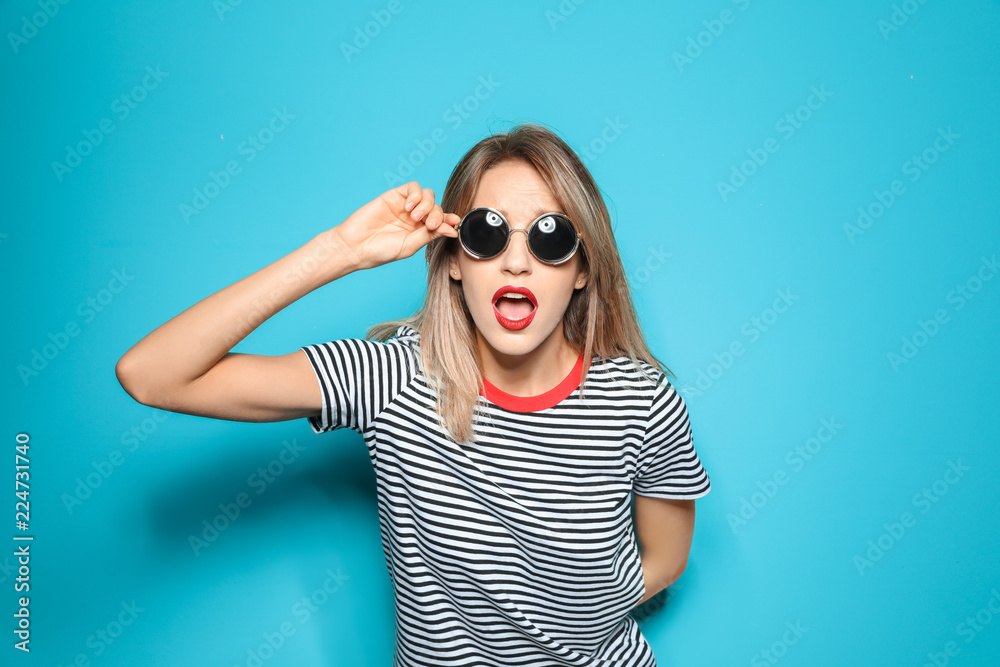 Beautiful young woman with healthy long blonde hair on color background Beautiful young woman with healthy long blonde hair on color background
