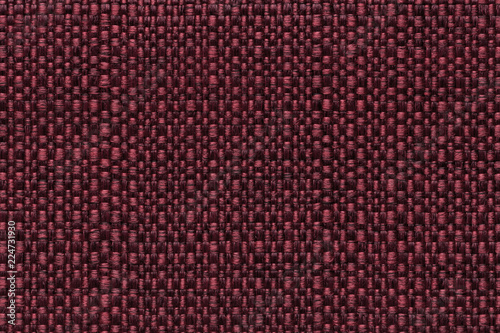 Dark red textile background with checkered pattern  closeup. Structure of the fabric macro.