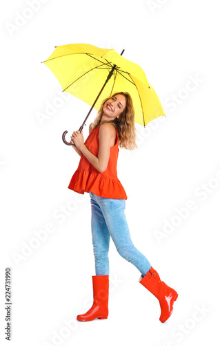 Woman with yellow umbrella on white background