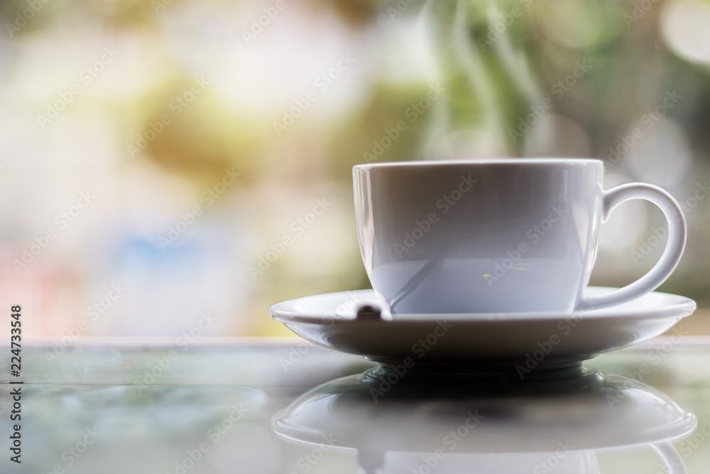 Hot coffee on table in bokeh background Hot coffee on table in bokeh background