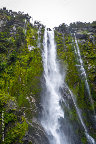 Waterfall in Milford Sound lake  New Zealand