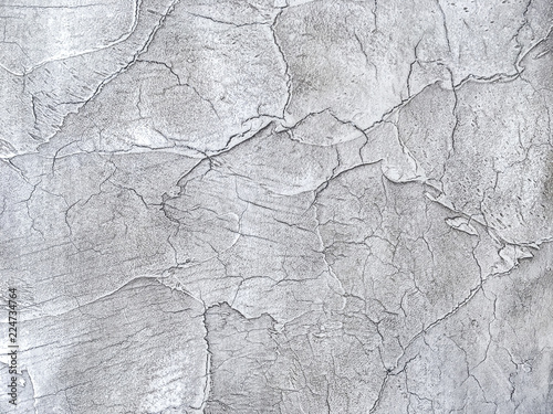 Texture decorative silver plaster imitating the old peeling wall.