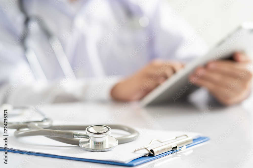 Stethoscope placed on the doctor's desk in the hospital.