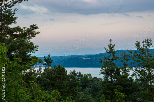 Germany, Sunset over alps mountains behind lake constance