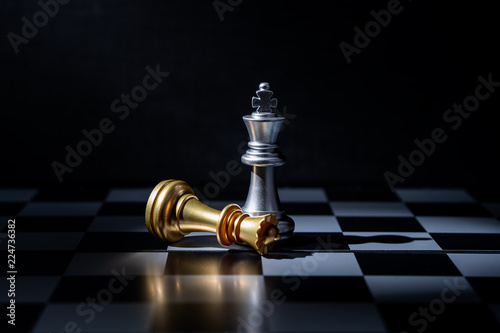 Chess board game for business concept in light and shadow.