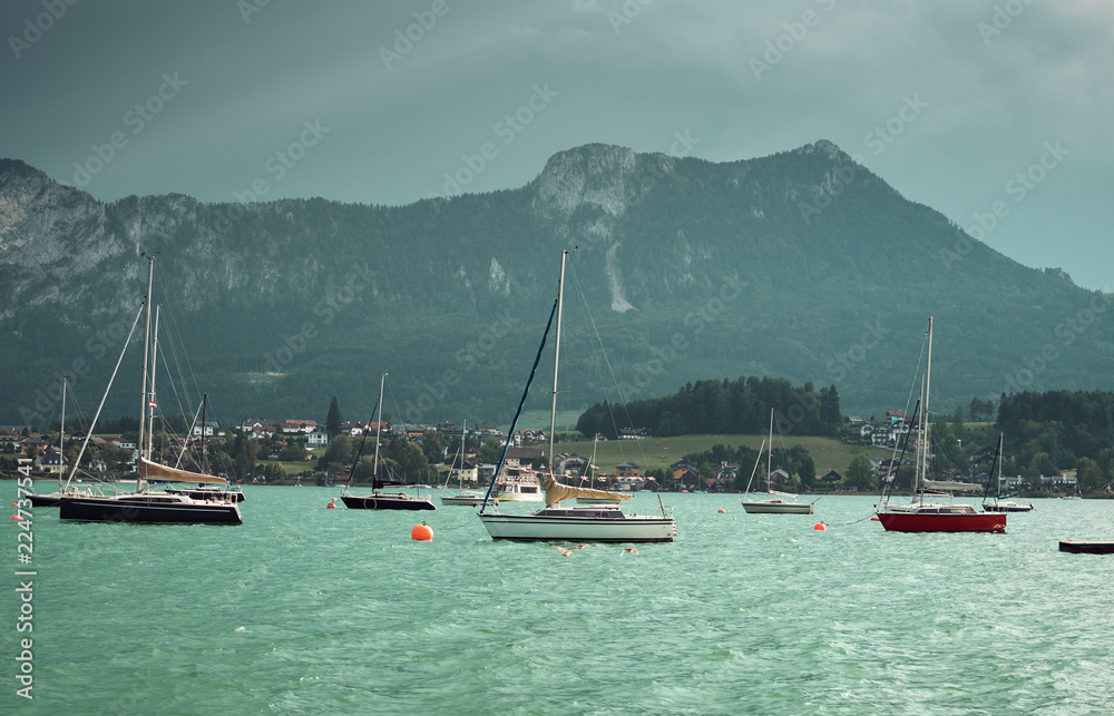 Sailing boats on sea near countryside coast Sailing boats on sea near countryside coast