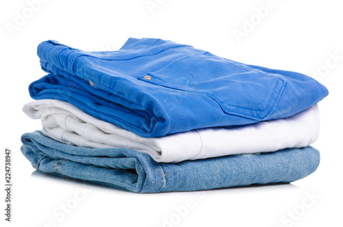 A stack of jeans clothes on a white background isolation