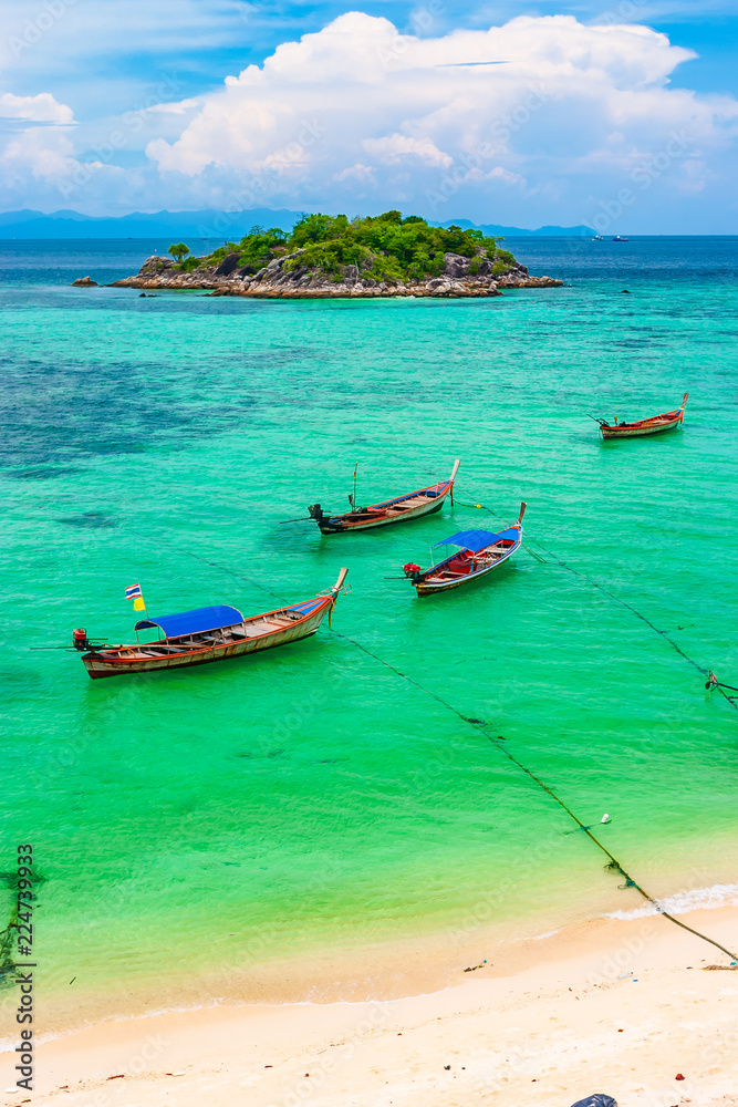 Emerald green clear glass and boat for tourist service, Southern Thailand Emerald green clear glass and boat for tourist service, Southern Thailand