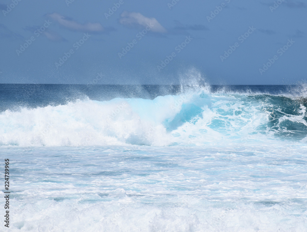 Huge waves crashing down into a frothy ocean, Pasta Point, Maldives.