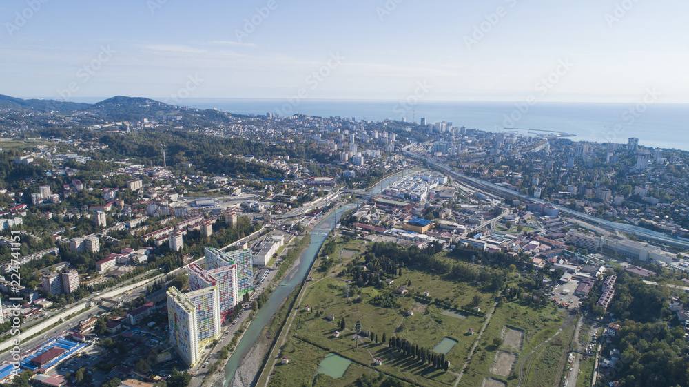 aerial view of a coastal town in mountains. Sochi, Russia aerial view of a coastal town in mountains. Sochi, Russia