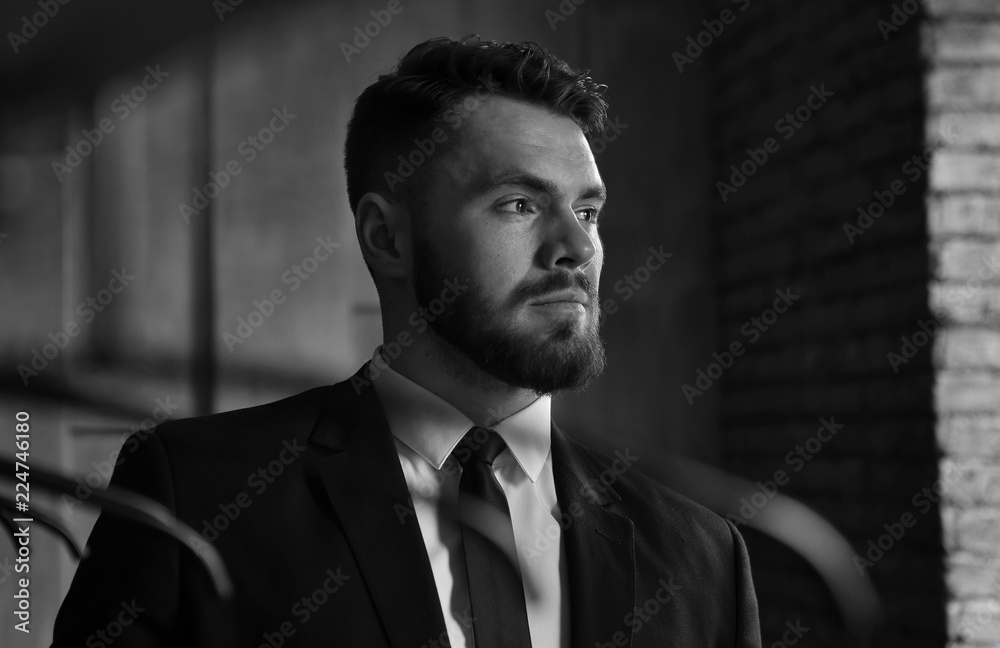 a man in a suit with a beard a man in a suit with a beard