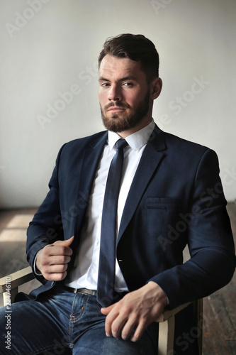 a man in a suit with a beard