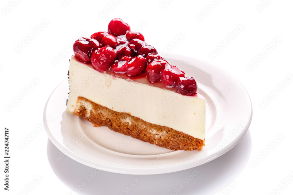 Cake with a cherry, isolated on a white background Cake with a cherry, isolated on a white background
