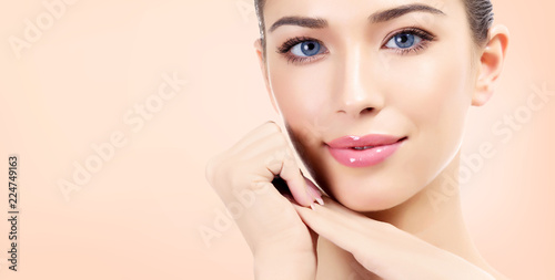 Pretty woman with clean and fresh skin is smiling to you. Beautiful girl portrait