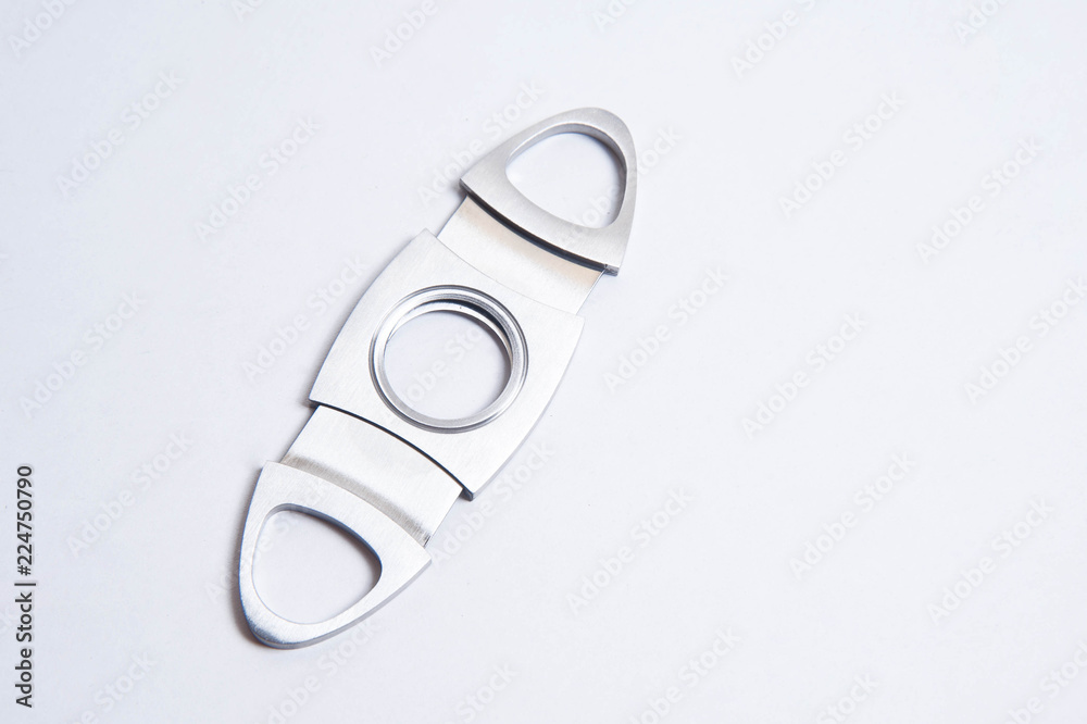 Metal cigar cutter isolated on white background Metal cigar cutter isolated on white background