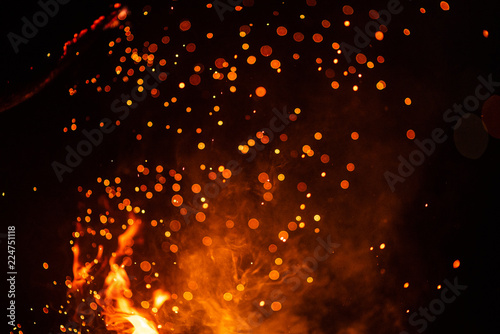 Fiery fire isolated on black isolated background . Beautiful yellow, orange and red fire flame texture style.